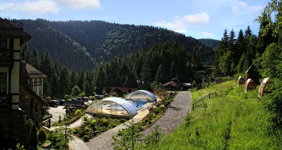 Recreation in the hotel with an outdoor pool in the Carpathians, summer